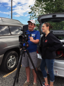 Two of Bonnemaison, Inc. summer interns working with film gear on location