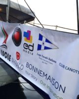 Banner of sponsors on the bridge on the 33 Isole launch party boat in Italy