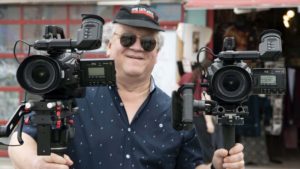 Bonnemaison Inc team members holding two Blackmagic Design Ursa Minis 4K on Venice Beach